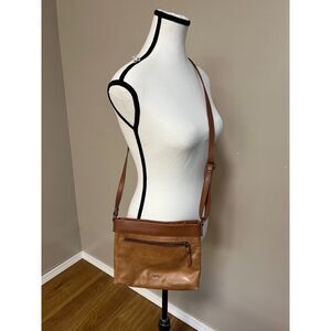 The Sak matte floral embossed tan leather Sanibel crossbody bag